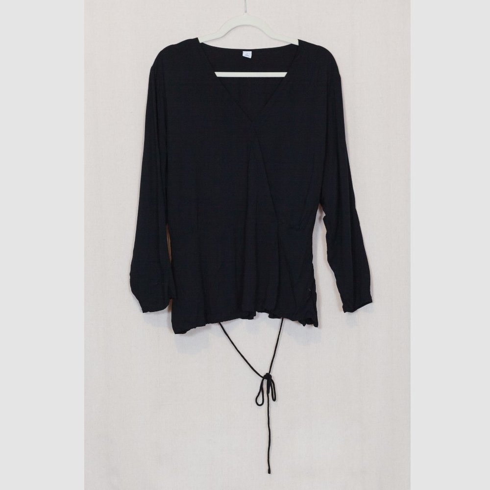 Plunge neck, faux wrap long sleeved blouse